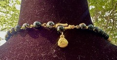 vintage-style black and gold beaded statement necklace,