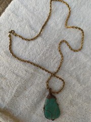 A braided red copper necklace a medium-sized, rare pear-shaped pure turquois