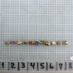 Vintage Sliding 9 Charm Bracelet 6 3/8”L Jeweled and Figural Unbranded