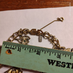 VINTAGE MONET GOLD TONE BRACELET WITH 6 CHARMS AND SAFETY CHAIN 4 leaf clover