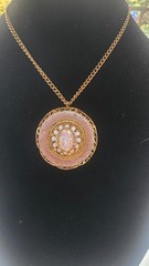 Vintage gold toned filigree pendant necklace with pink faux fire cabochon opal