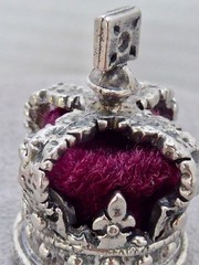 VINTAGE SILVER PLATE CROWN CHARM RED MATERIAL & SILVER 1 1/8″ MINIATURE CROWN