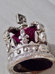 VINTAGE SILVER PLATE CROWN CHARM RED MATERIAL & SILVER 1 1/8″ MINIATURE CROWN