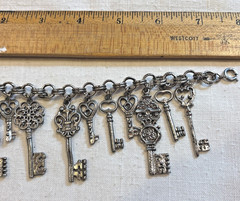 Vintage Key Silver Tone Seven Charm Silver tone Bracelet 6.5″
