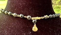 vintage-style black and gold beaded statement necklace,
