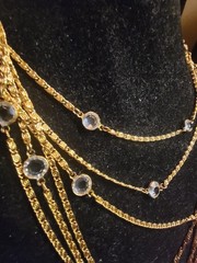 Vintage gold-tone necklace features length and crystals