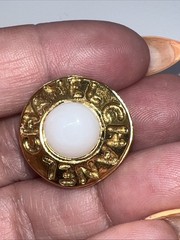 Vintage CHANEL golden round shape faux pearl earrings with cutout logo. Clip On