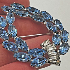 Vintage B. David silver tone brooch featuring rhinestones