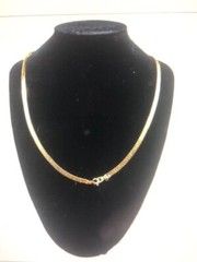 Gold tone Zig Zag Necklace With Green Stones