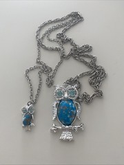 Vintage-style silver-tone owl pendant featuring a faux turquoise