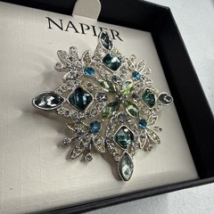 Napier silver-tone snowflake pin/brooch featuring blue and green rhinestones NOS