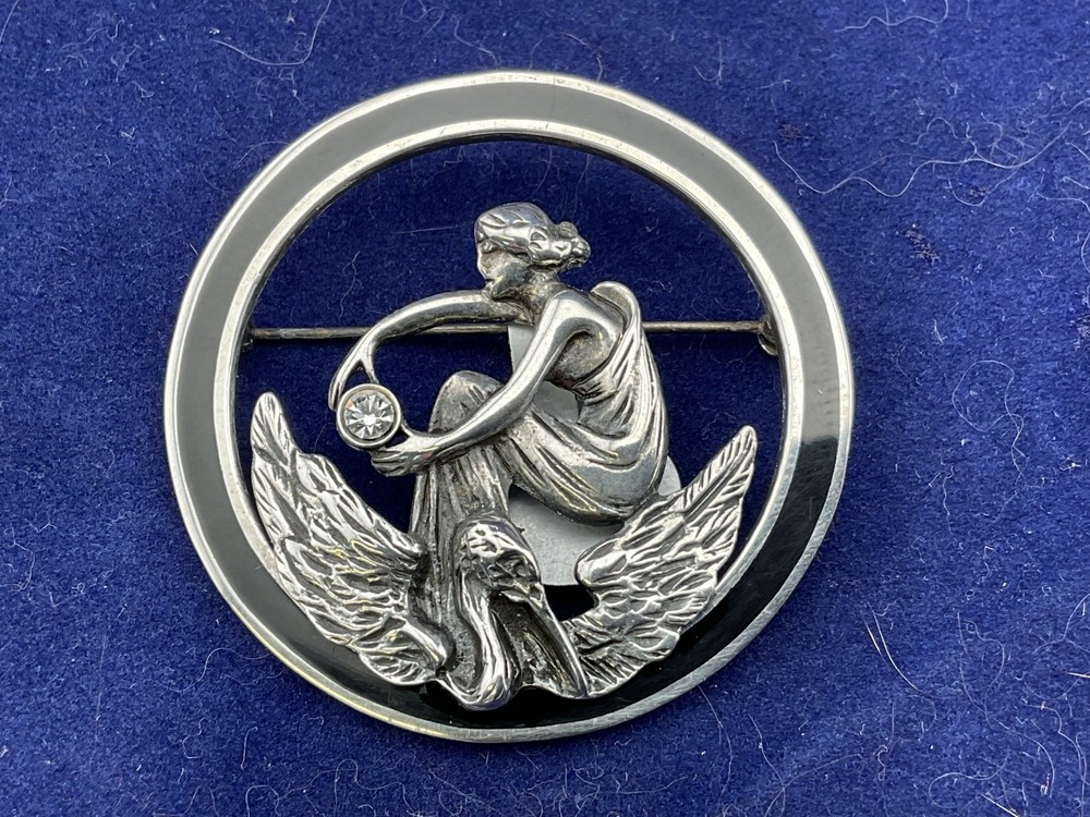 art nouveau style sterling silver pin woman and bird 1 5/8” diaameter