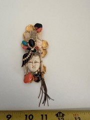 VINTAGE ASIAN BROOCH WITH CARVED FACE AND JEWLEL SIGNED