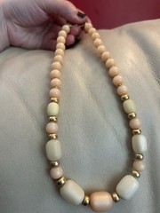 1980s Napier Pale Orange and Cream Lucite with Gold spacers Necklace.