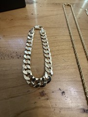 1 Watch, (2) 14 Karat Gold Plated Necklaces, (1 ) 14 Karat Gold Plated Bracelet