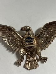 Vintage eagle brooch 1.5 Inches X 2 Inches Gold Colored With Red White And Blue