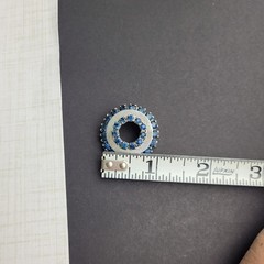 Vintage Small Silver Tone Circle Brooch With Dark Blue Rhinestones