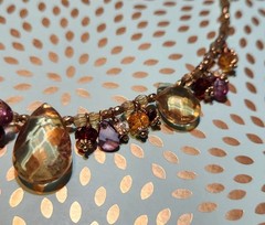 Vtg Cookie Lee faceted Purples/Yellows Lucite Charm Necklace on pale Gold chain