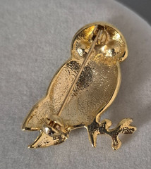 Cute, vintage owl brooch with black enamel and green rhinestone eyes