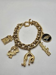 Vintage Jackie Collins Gold Tone Enamel Lady Boss Charm Bracelet Toggle Clasp