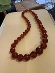 24 Inch long Vintage Graduating large bead Amber Necklace w matching clasp