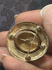 Vintage 1970s Avon Spinner Brooch Gold Tone Rotating Starburst Rhinestone Signed