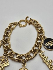 Vintage Jackie Collins Gold Tone Enamel Lady Boss Charm Bracelet Toggle Clasp