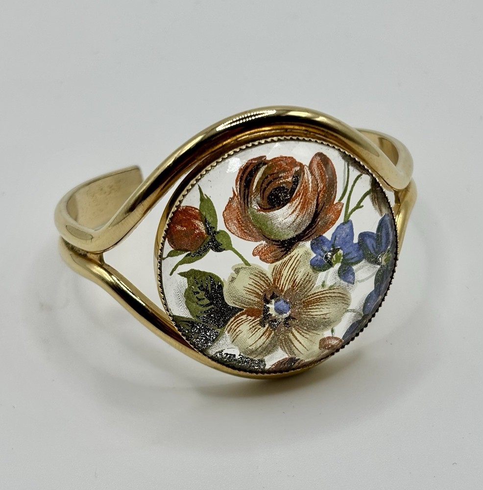 Vintage French flower medallion cuff bracelet gold-toned metal and resin.