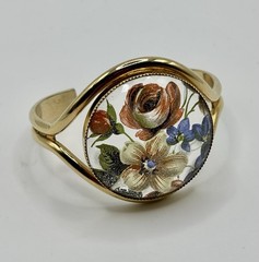 Vintage French flower medallion cuff bracelet gold-toned metal and resin.