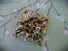 large brooch gold tone with faux opal + red, green &clear zircons