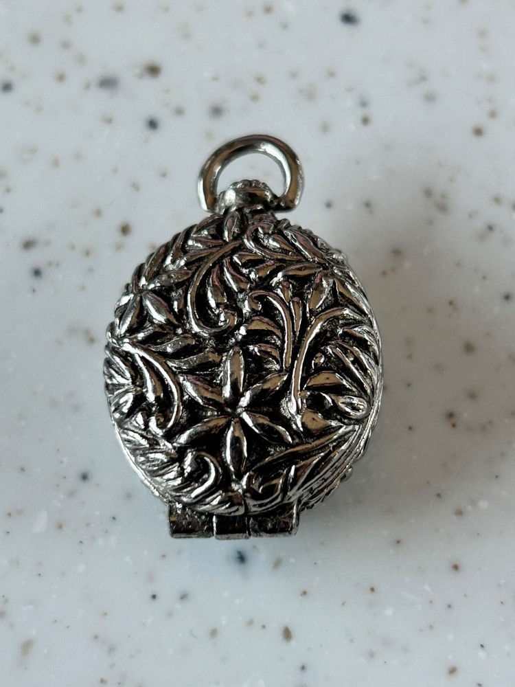 Goldette silver toned floral locket pendant