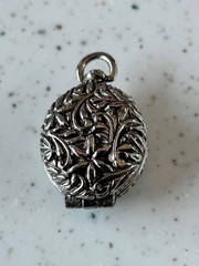 Goldette silver toned floral locket pendant