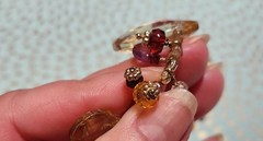 Vtg Cookie Lee faceted Purples/Yellows Lucite Charm Necklace on pale Gold chain