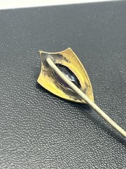 Antique Victorian gold tone stick pin purple glass faceted stone scroll design