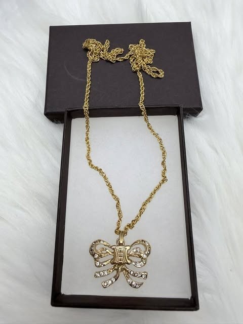 Authentic CELINE Paris Gold Tone Bow Crystal Pendant Necklace 26 in.