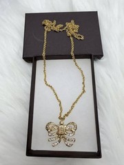 Authentic CELINE Paris Gold Tone Bow Crystal Pendant Necklace 26 in.