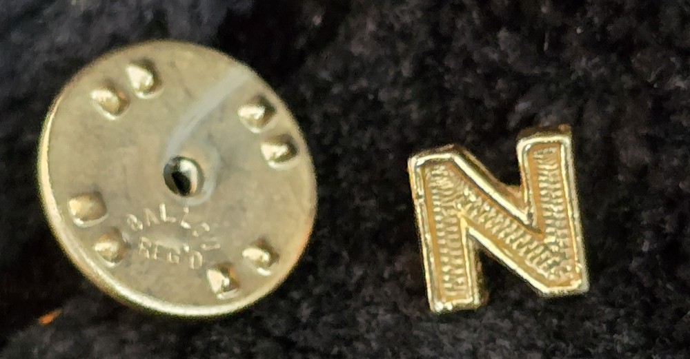 B.A. Ballou & Co., indicated by the “BALLOU REG’D” Letter “N” lapel pin VINTAGE