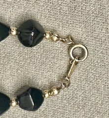 Vintage Avon “Modern Art” chunky black bead necklace with gold-tone spacers