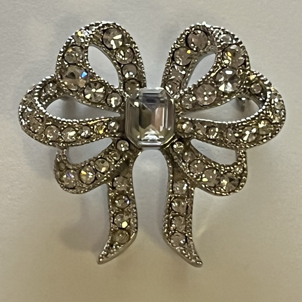 Vintage Monet Clear Rhinestones Bow Brooch Silver Tone Emerald Cut Center Stone