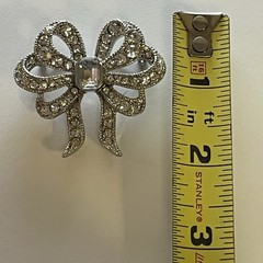 Vintage Monet Clear Rhinestones Bow Brooch Silver Tone Emerald Cut Center Stone