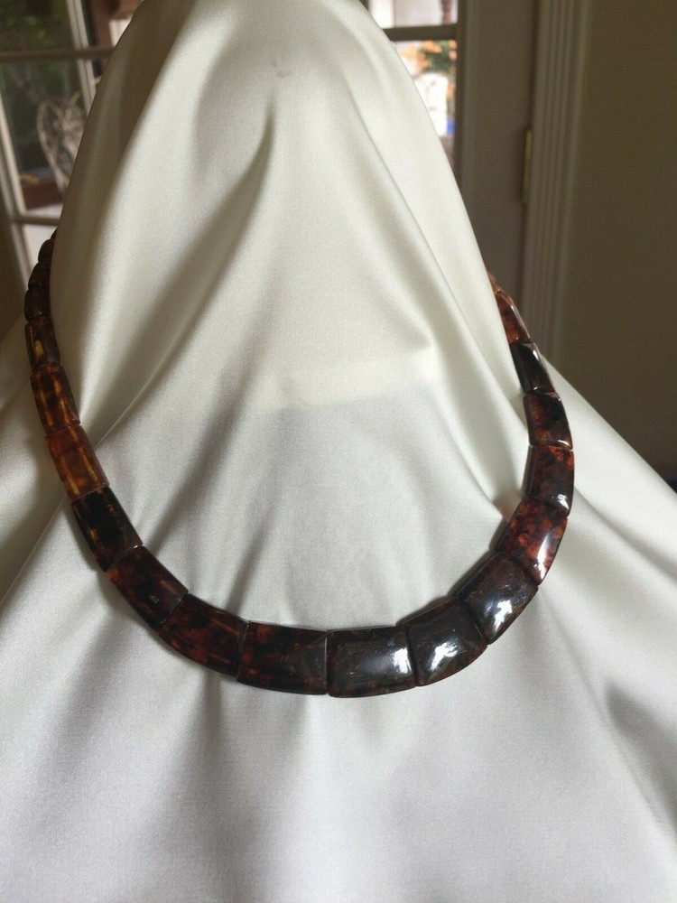 18″ Amber Necklace With Magnetic Clasp.  Width varies from 3/16″ to 3/4″.  