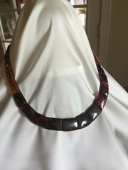 18″ Amber Necklace With Magnetic Clasp.  Width varies from 3/16″ to 3/4″.  