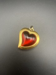 VTG 80’s Yves Saint Laurent (YSL) gold-tone metal and red resin heart pendant.