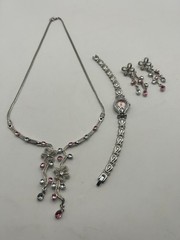 Delicate silver plated metalwork w pink and white stones in floral arrangement