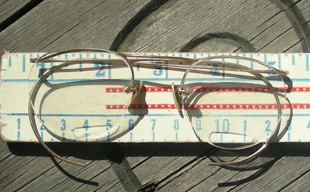 Gold “Granny” bifocal glasses, in attic