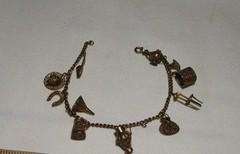 Adorable Gilded Silver Vintage Charm Bracelet. Approximately 8″ long.