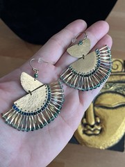 Vintage-style beaded necklace with a square, metal pendant paired with earrings