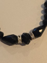 vintage-style beaded necklace black faceted beads and silver-toned spacers.