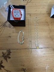 1 Watch, (2) 14 Karat Gold Plated Necklaces, (1 ) 14 Karat Gold Plated Bracelet