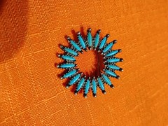 starburst brooch approx. 1″ wide Turquoise colored stones not natural I don’t th